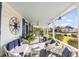 Cozy front porch with comfortable seating and stylish decor, perfect for relaxing outdoors at 1808 Ion Ave, Sullivans Island, SC 29482