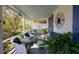 Inviting front porch with comfortable seating and a compass rose decoration at 1808 Ion Ave, Sullivans Island, SC 29482