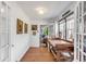 Hallway with wood floors and a vintage desk, leading to a bright living space at 1808 Ion Ave, Sullivans Island, SC 29482