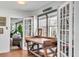 Bright hallway with a vintage desk and french doors to the living area at 1808 Ion Ave, Sullivans Island, SC 29482