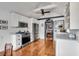 Bright kitchen with white cabinets, stainless steel appliances, and hardwood floors at 1808 Ion Ave, Sullivans Island, SC 29482