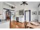 Eat-in kitchen featuring white cabinets, farmhouse sink, and hardwood floors at 1808 Ion Ave, Sullivans Island, SC 29482