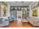 Bright living room with wood floors, bookshelves, and stylish decor at 1808 Ion Ave, Sullivans Island, SC 29482