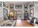 Sun-filled living room with wood floors, stylish decor, and inviting seating at 1808 Ion Ave, Sullivans Island, SC 29482