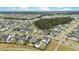 Wide aerial view of a community featuring well-maintained homes, green spaces, and tree-lined streets at 182 Callibluff Dr, Summerville, SC 29486