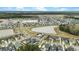 Sweeping aerial view of a community featuring ponds, diverse home styles, and serene surrounding at 182 Callibluff Dr, Summerville, SC 29486