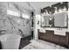 Spa-like bathroom with dual vanities, marble accents, and a luxurious soaking tub at 182 Callibluff Dr, Summerville, SC 29486