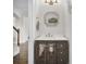 Chic powder room with decorative mirror, vanity, and modern fixtures at 182 Callibluff Dr, Summerville, SC 29486
