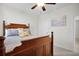 Bright bedroom with a wooden bed frame, soft carpet, and neutral decor for a peaceful setting at 182 Callibluff Dr, Summerville, SC 29486
