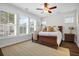 Bright bedroom featuring large windows, plantation shutters, and a cozy rug at 182 Callibluff Dr, Summerville, SC 29486