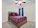 Inviting bedroom features soft carpet, a ceiling fan, and comfortable bed with colorful bedding at 182 Callibluff Dr, Summerville, SC 29486