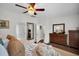 A spacious bedroom, featuring ample storage with dresser and side tables, and an ensuite bathroom at 182 Callibluff Dr, Summerville, SC 29486