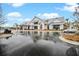 Modern community building with white siding, metal roof, and wet roads on a cloudy day at 182 Callibluff Dr, Summerville, SC 29486