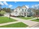 Two-story home with a manicured lawn and inviting front porch that enhances the home's curb appeal at 182 Callibluff Dr, Summerville, SC 29486