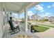 Inviting front porch with comfortable rocking chairs and a view of the neighborhood, perfect for relaxing at 182 Callibluff Dr, Summerville, SC 29486