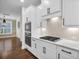 Bright kitchen featuring white cabinets, stainless steel appliances, and hardwood floors at 182 Callibluff Dr, Summerville, SC 29486