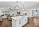 Well-appointed kitchen with island, pendant lights, and open living space at 182 Callibluff Dr, Summerville, SC 29486