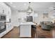 Bright kitchen with island, seating, modern lighting, and stainless appliances at 182 Callibluff Dr, Summerville, SC 29486
