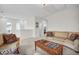 Cozy living room with neutral carpet, comfortable seating, and a charming wooden coffee table at 182 Callibluff Dr, Summerville, SC 29486