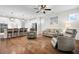 Open-concept living room with hardwood floors, modern lighting, and a seamless flow to the kitchen at 182 Callibluff Dr, Summerville, SC 29486