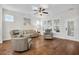 Cozy living room featuring hardwood floors, plantation shutters, and comfortable seating at 182 Callibluff Dr, Summerville, SC 29486