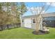 Well-maintained storage shed in a landscaped yard, offering practical storage solutions for outdoor equipment at 182 Callibluff Dr, Summerville, SC 29486