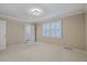 Neutral bedroom featuring shuttered windows and an ensuite bathroom access for a peaceful and private retreat at 202 Crestwood Dr, Summerville, SC 29483