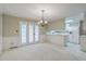 Open dining area with French doors and views into the kitchen, perfect for entertaining guests at 202 Crestwood Dr, Summerville, SC 29483