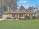 Charming single-story home featuring a well-manicured lawn and an inviting front entrance at 202 Crestwood Dr, Summerville, SC 29483