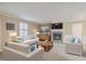Bright living room with comfortable seating, a fireplace, and stylish decor for relaxation at 202 Crestwood Dr, Summerville, SC 29483