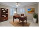 Inviting office space with wood furniture, shuttered windows, and ample natural light, conducive for productivity at 202 Crestwood Dr, Summerville, SC 29483