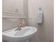 Cozy half-bathroom features a clean pedestal sink with chrome fixtures, and a patterned towel at 205 Yellow Hawthorn Cir, Summerville, SC 29483