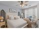 Bright bedroom featuring a comfortable bed, soft lighting, and charming decor at 205 Yellow Hawthorn Cir, Summerville, SC 29483