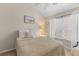 Serene bedroom with natural light, soft bedding, and neutral decor creates a relaxing retreat at 205 Yellow Hawthorn Cir, Summerville, SC 29483