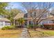 Charming brick and siding townhome featuring a landscaped front yard and inviting entrance at 205 Yellow Hawthorn Cir, Summerville, SC 29483