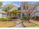 Charming front exterior with a brick-accented entrance and well-maintained landscaping at 205 Yellow Hawthorn Cir, Summerville, SC 29483