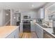 Bright kitchen featuring updated stainless appliances, ample cabinet space and eat in island at 205 Yellow Hawthorn Cir, Summerville, SC 29483