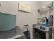 Convenient laundry area with modern machines, storage shelves, and practical design at 205 Yellow Hawthorn Cir, Summerville, SC 29483