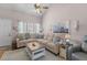 Inviting living room featuring vaulted ceiling, comfortable seating and an abundance of natural light at 205 Yellow Hawthorn Cir, Summerville, SC 29483