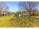 Scenic view of a pond and fountain surrounded by lush greenery and mature trees at 205 Yellow Hawthorn Cir, Summerville, SC 29483