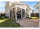 Backyard featuring a brick patio with outdoor seating and a screen door leading to the house at 207 Billinger St, Summerville, SC 29486
