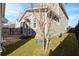Backyard featuring lush green lawn and a patio area, framed by the exterior of the house at 207 Billinger St, Summerville, SC 29486