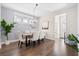 Elegant dining room featuring a modern chandelier, hardwood flooring, and neutral wall color at 207 Billinger St, Summerville, SC 29486