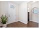 Bright foyer featuring hardwood floors, a stylish mirror, and a white front door at 207 Billinger St, Summerville, SC 29486