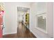 Inviting hallway with hardwood floors and a glimpse into the living area at 207 Billinger St, Summerville, SC 29486