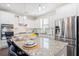 Modern kitchen featuring white cabinets, stainless steel appliances, and a granite island at 207 Billinger St, Summerville, SC 29486