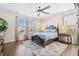 Comfortable main bedroom with a ceiling fan, hardwood floors, and ample natural light at 207 Billinger St, Summerville, SC 29486