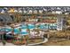 Aerial view of community pool and play area surrounded by palm trees and beautifully designed homes at 207 Billinger St, Summerville, SC 29486