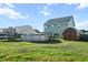 Spacious backyard with above-ground pool, storage shed, and wooden swing set at 2150 Pimlico Dr, Ridgeville, SC 29472