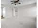 Comfortable bedroom featuring neutral carpet, ceiling fan, and access to the hallway at 2150 Pimlico Dr, Ridgeville, SC 29472
